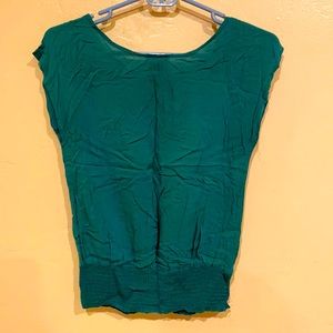 Burnt green shirt with shirring at the bottom. Have it in black too.